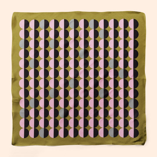 Designer geometric silk scarf in pink and olive green. Wear as a neckerchief for a striking look