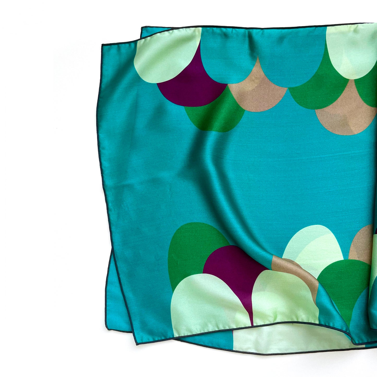 Inspired by sweets, this long silk charmeuse scarf in bold teals and creams looks good enough to eat. Add a touch of luxury to your outfit by using this as a bandana or headscarf