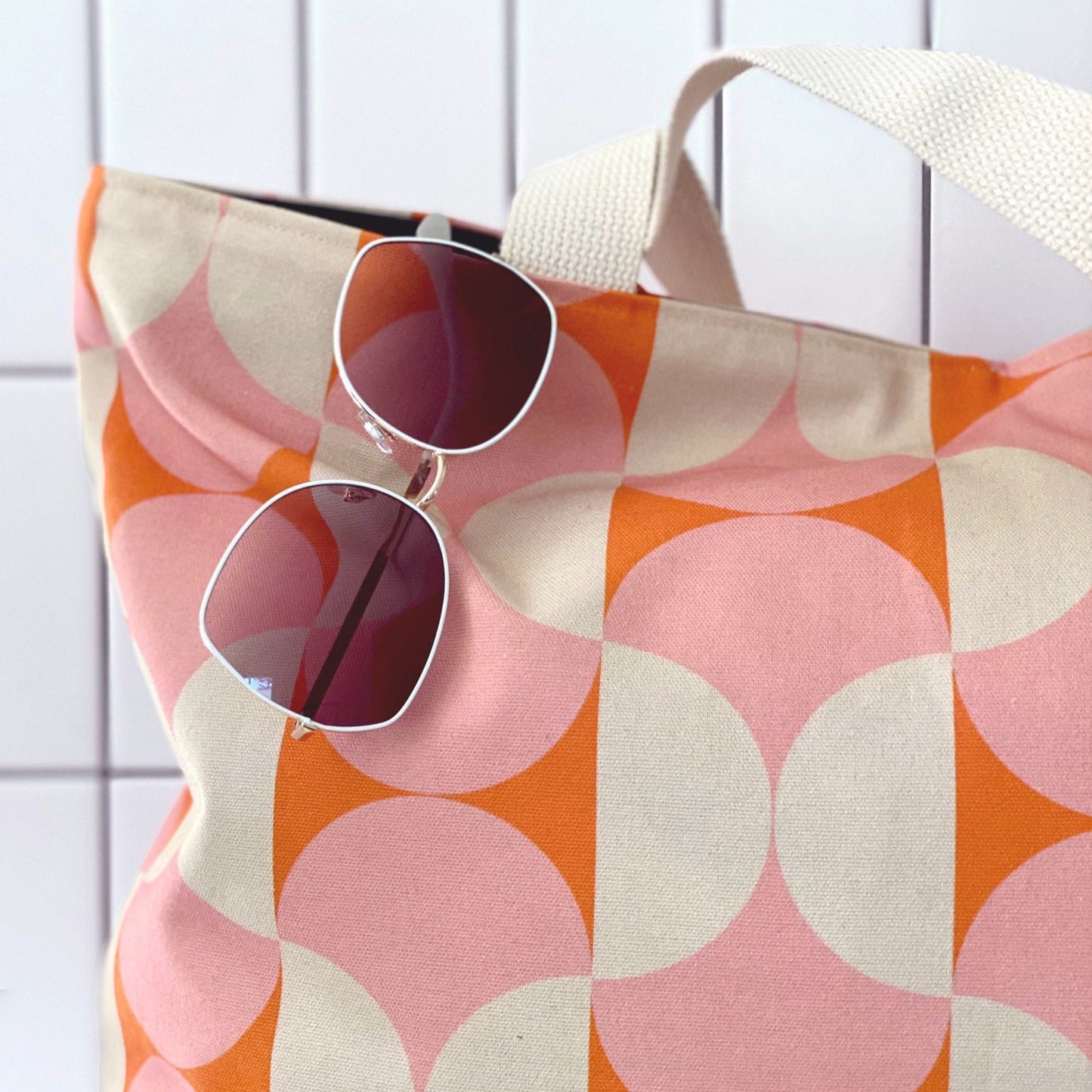 Retro 60's style pink and orange geometric print on this oversized canvas tote. Great for beach, market, travel, and every day.