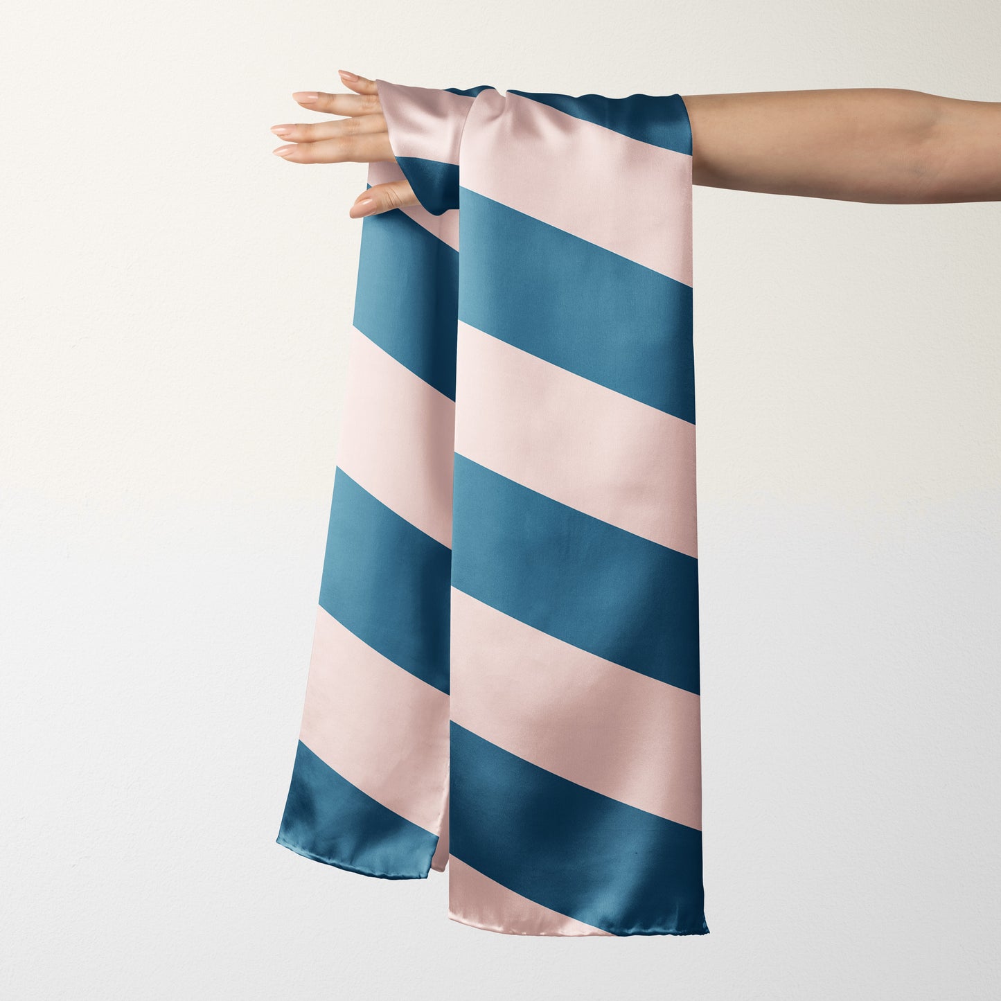 Add some luxury to your wardrobe with this designer blue striped silk scarf. Attach it to your purse, or wear it as a bandana