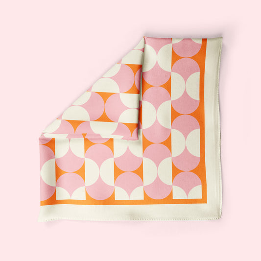 Mod Pod is a square retro neckerchief in pink and orange
